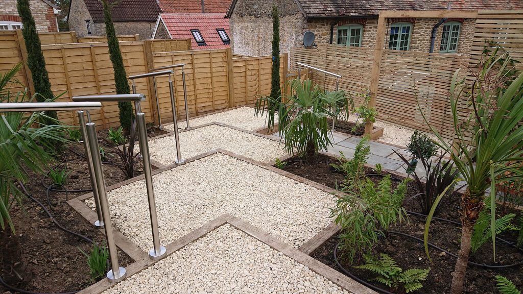 series of garden terraces with gravelled surface and steel ballustrade