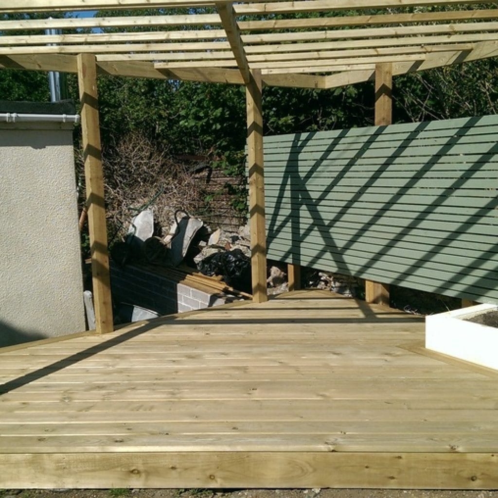 traditional timber deck beneath timber pergola with slatted roof