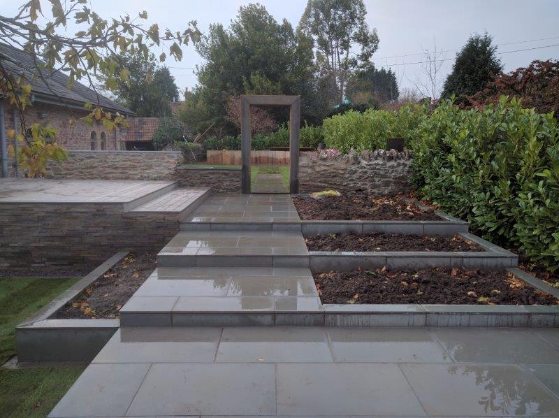 partially built garden in Rodney Stoke incorporating existing laurel hedge