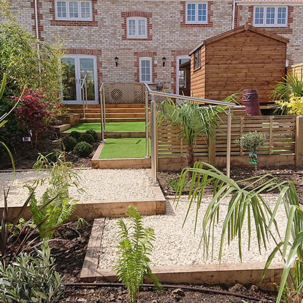 artificial grass in low maintenance garden