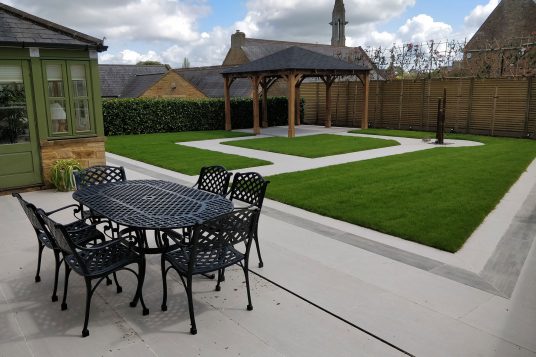 contemporary garden with porcelain paving and lawn