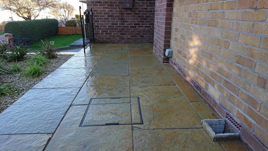 natural stone patio with a rich blend of buff, terracotta and ochre colours