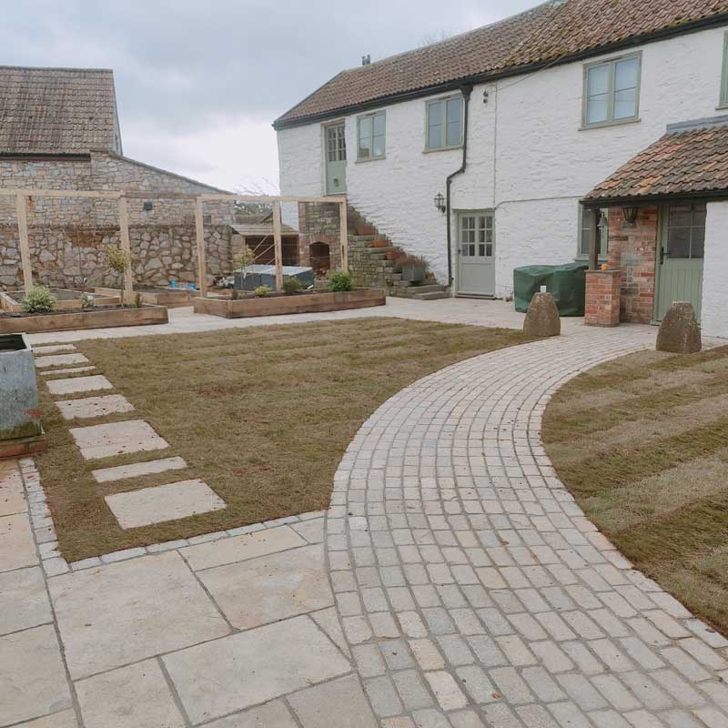 mixed textures of limestone setts and reclaimed limestone slabs