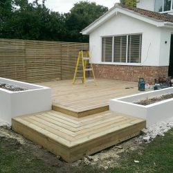 raised decking area surrounded by planting troughs