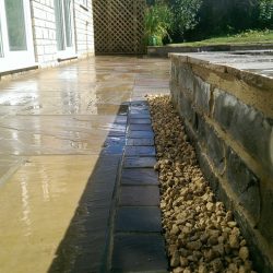 gravel border tbetween patio and retaining wall