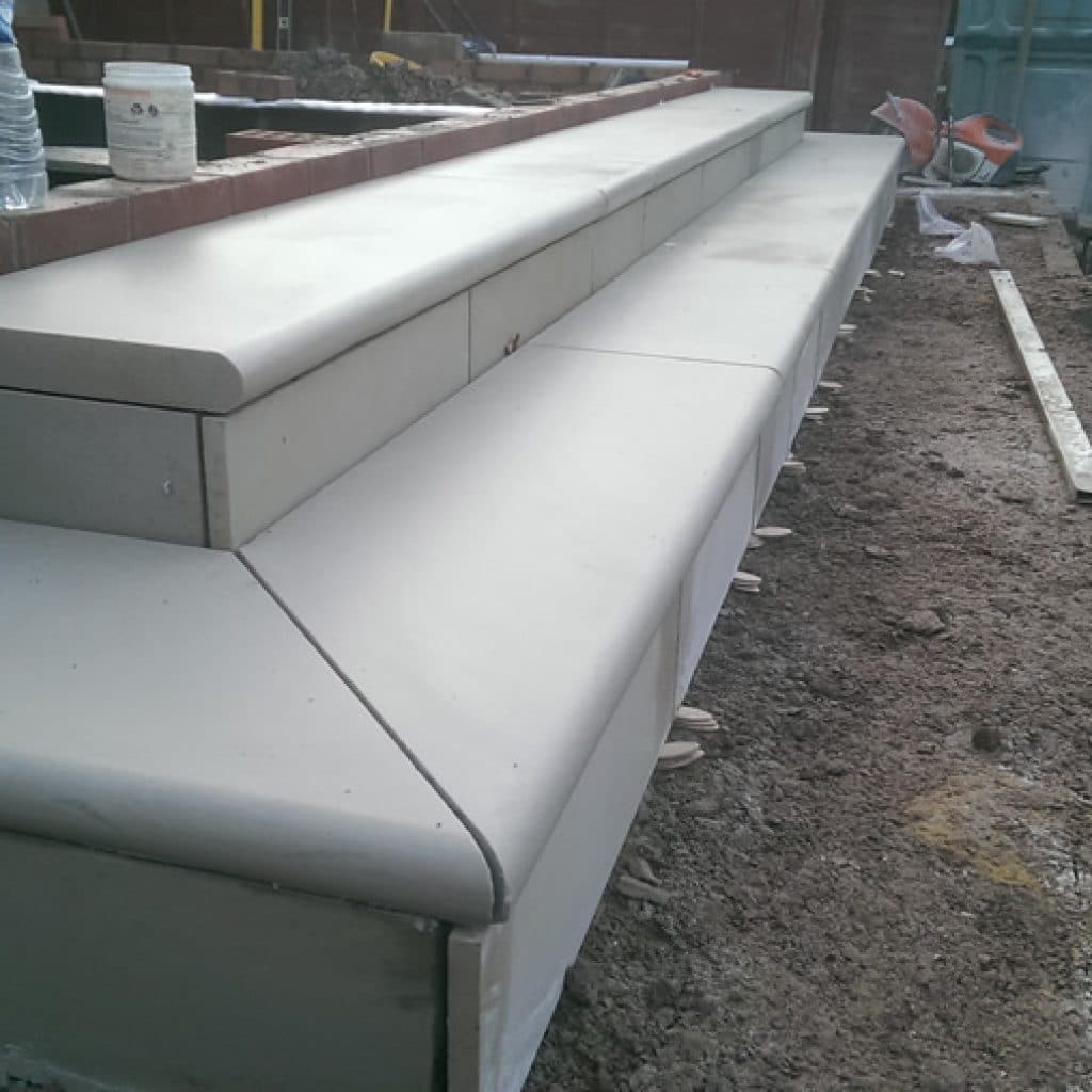 bullnose steps being installed into a landscaping project
