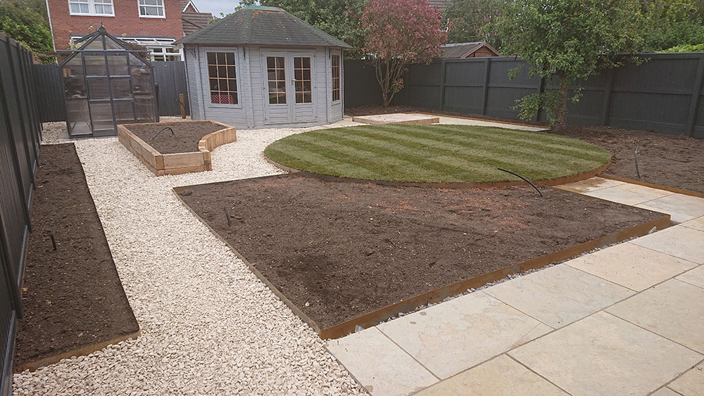 newly turfed circular lawn with stripes