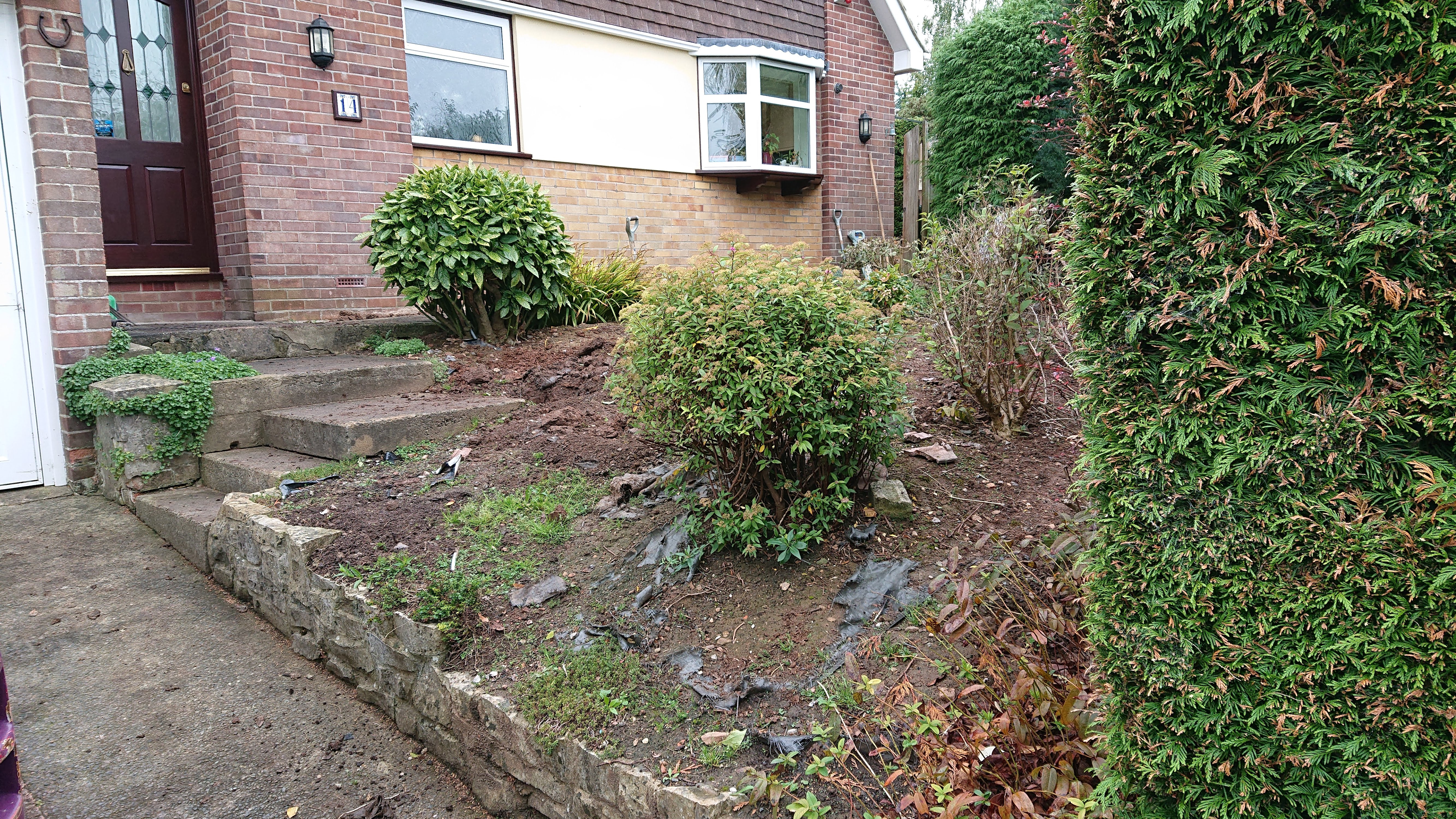 sloping front garden in need of garden design and landscaping