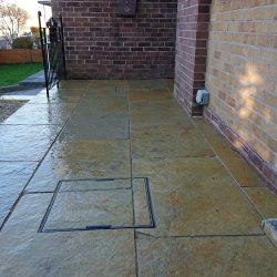 natural stone patio with a rich blend of buff, terracotta and ochre colours