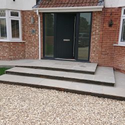 front entranceway with steps and gravel driveway