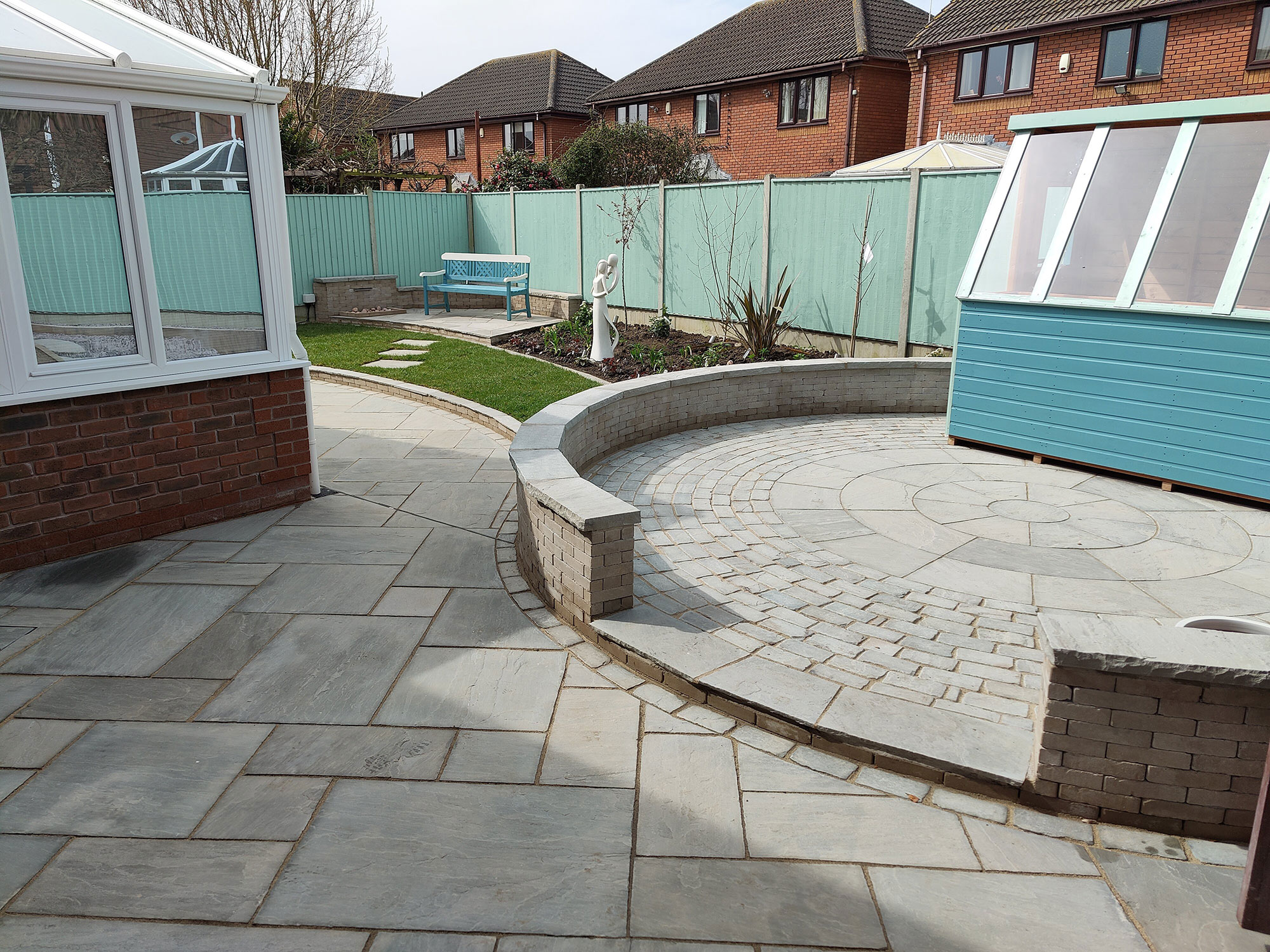 gorgeous garden with curved patios, lawns and flower beds