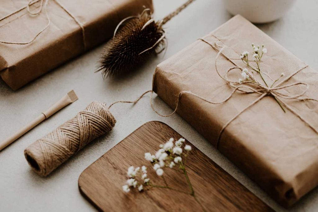 gifts wrapped in eco friendly paper and decorated with dried flowers
