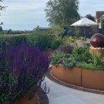 Porcelain paving and Corten raised beds