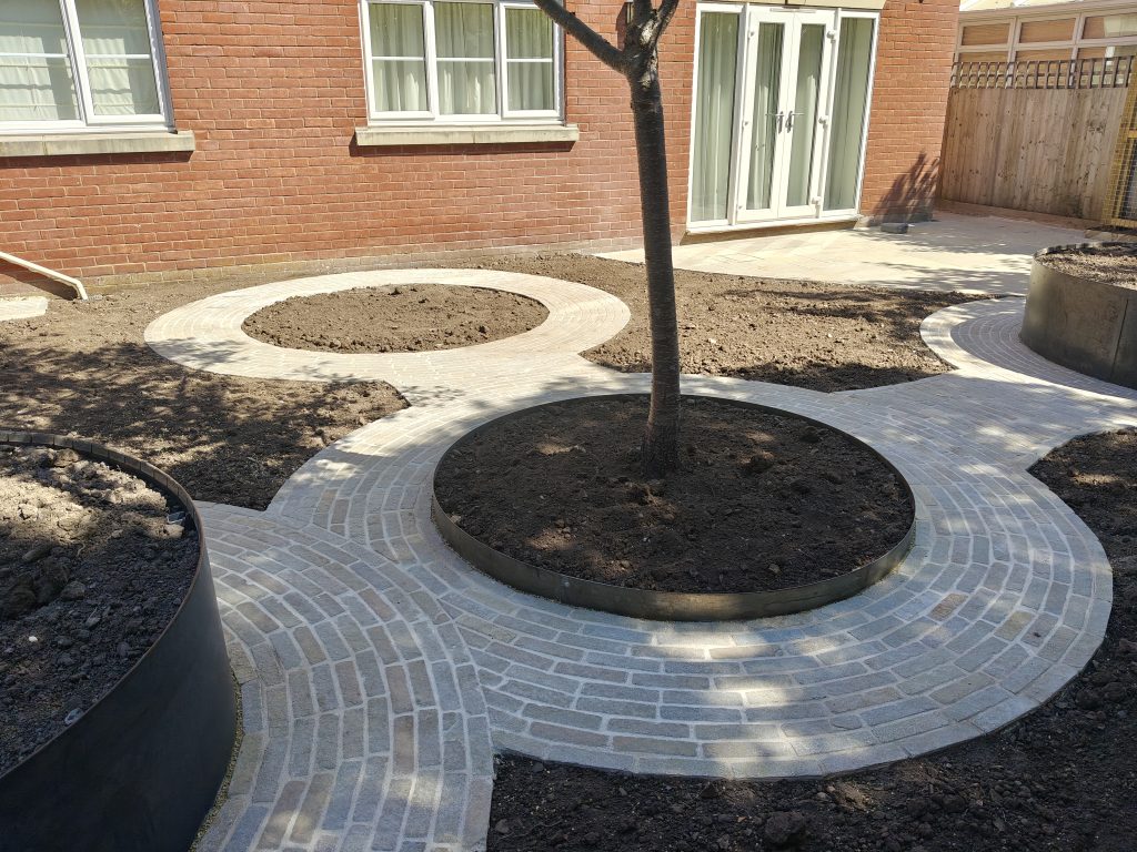curved paths with limestone setts